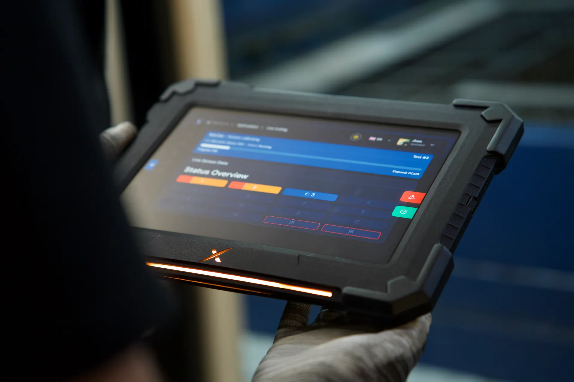 Close-up of the NexCut tablet with its amber status light on